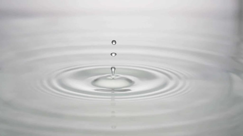 Water dropping on water creating little waves